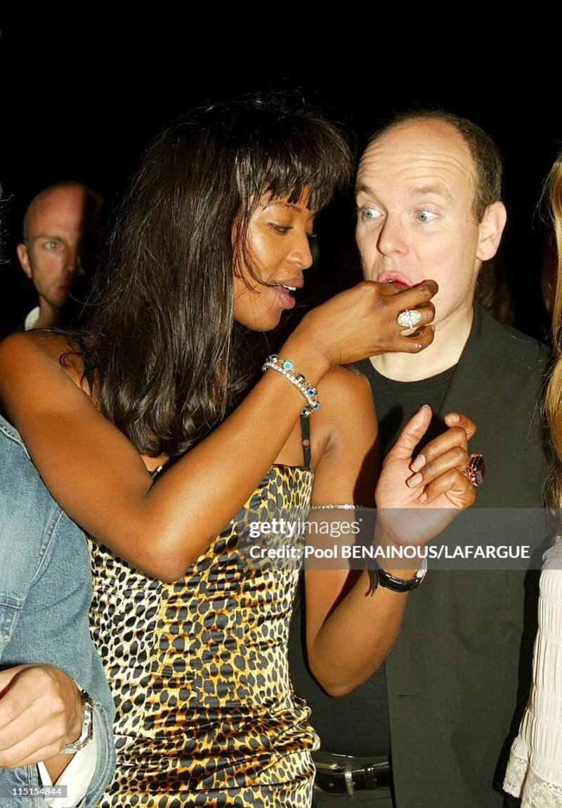 FRANCE - MAY 18: Prince Albert of Monaco at the birthday of Naomi Campbell in Saint Tropez, France on May 18, 2002 - Naomi Campbell with Prince Albert of Monaco (dress by Dolce and Gabana, diamonds from Bulgari). (Photo by Pool BENAINOUS/LAFARGUE/Gamma-Rapho via Getty Images)